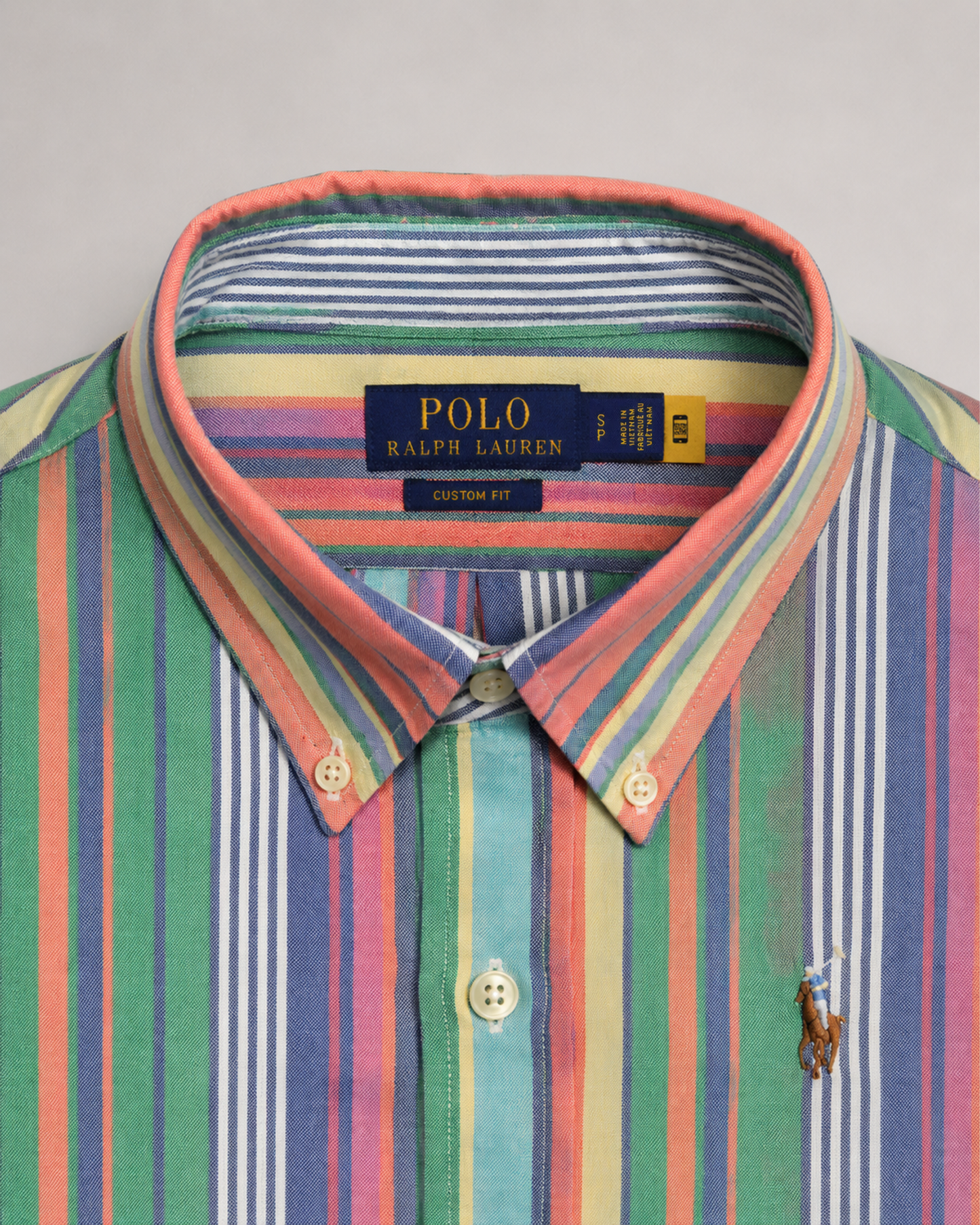 Colorful striped Polo Ralph Lauren pre-loved shirt custom fit with collar label detail tag on a background 