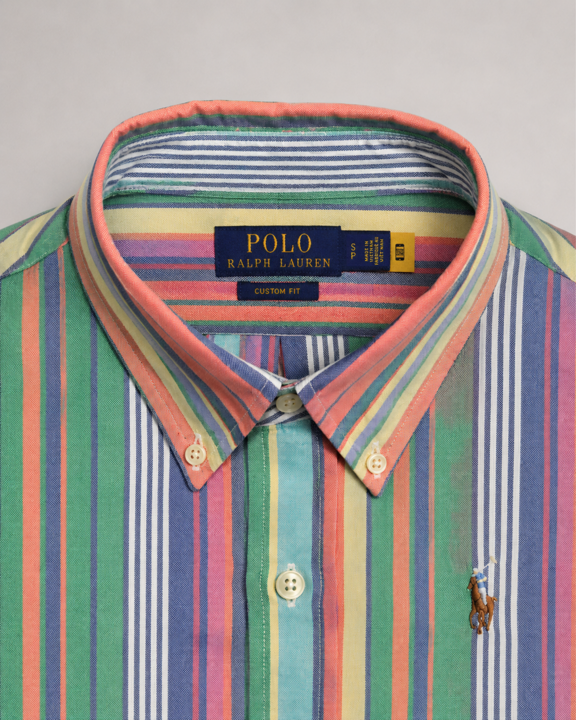 Colorful striped Polo Ralph Lauren pre-loved shirt custom fit with collar label detail tag on a background 