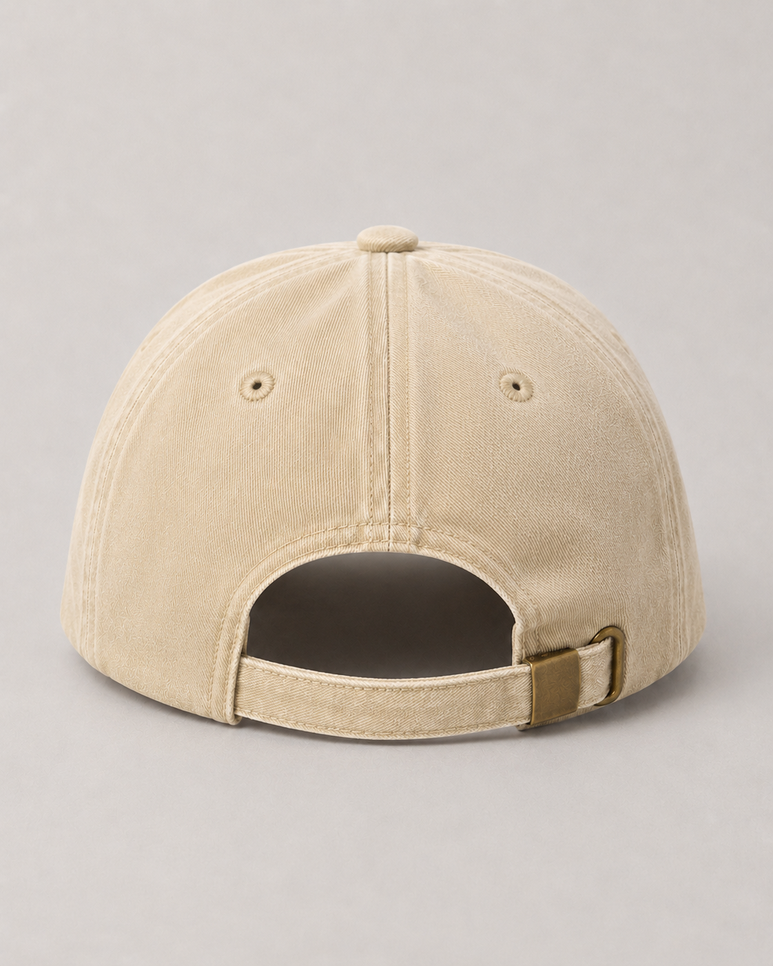 Beige baseball cap on a gray background