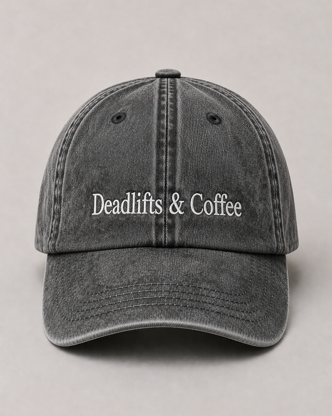 Gray cap with 'Deadlifts & Coffee' text on a light gray background