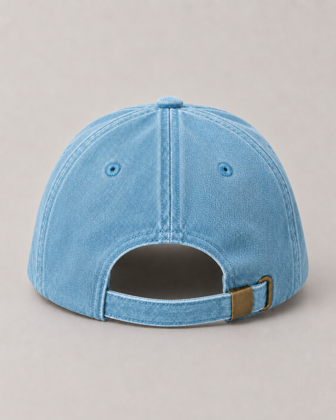 Blue denim cap on a gray background
