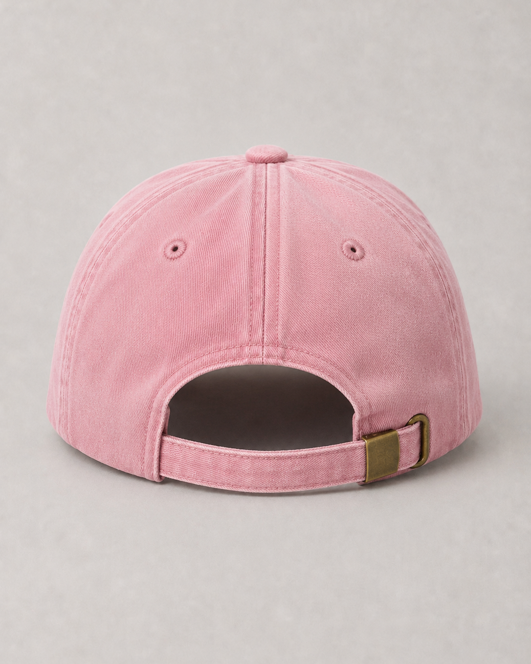 Pink baseball back cap on a gray background
