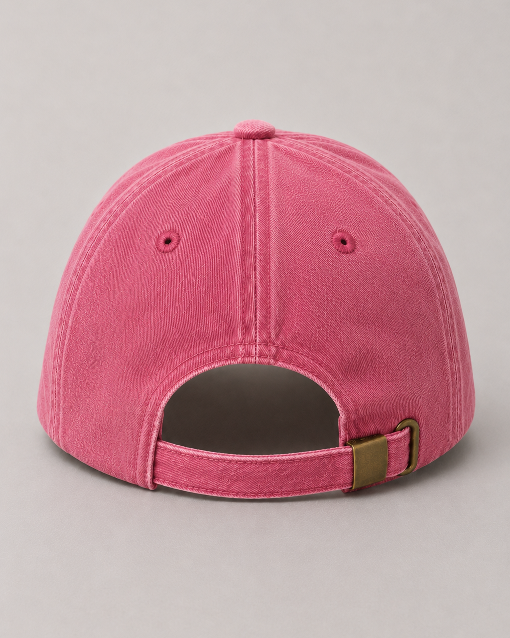 Pink baseball cap on a gray background